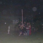 13-Orbs hover as some friends pose outdoors at night
